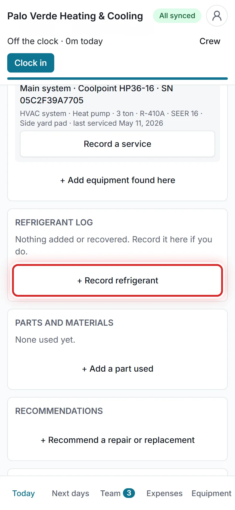 A tech recording refrigerant on a phone.